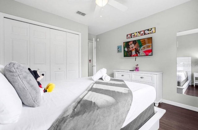 bedroom featuring dark hardwood / wood-style floors, a closet, and ceiling fan