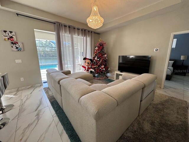 living room featuring an inviting chandelier