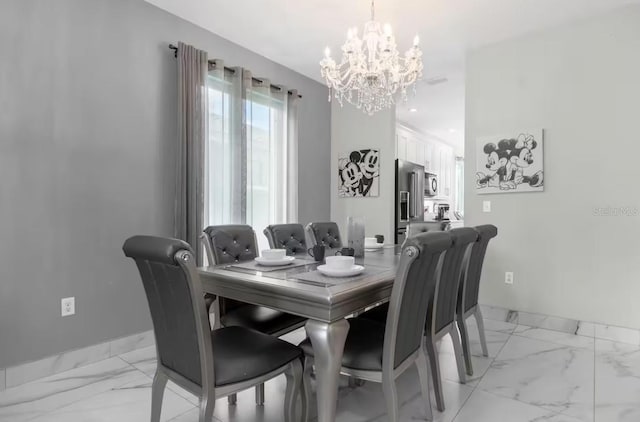 dining space featuring an inviting chandelier