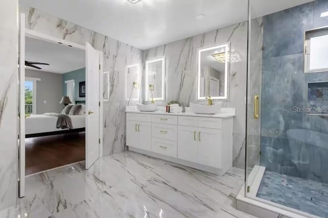 bathroom featuring vanity, a shower with door, and ceiling fan