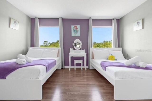 2912 Sunset Lakes Blvd, Kissimmee, FL 34747 - bedroom with wood finished floors