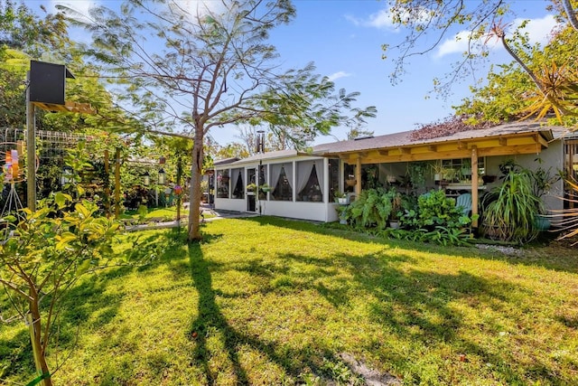 view of yard with a sunroom