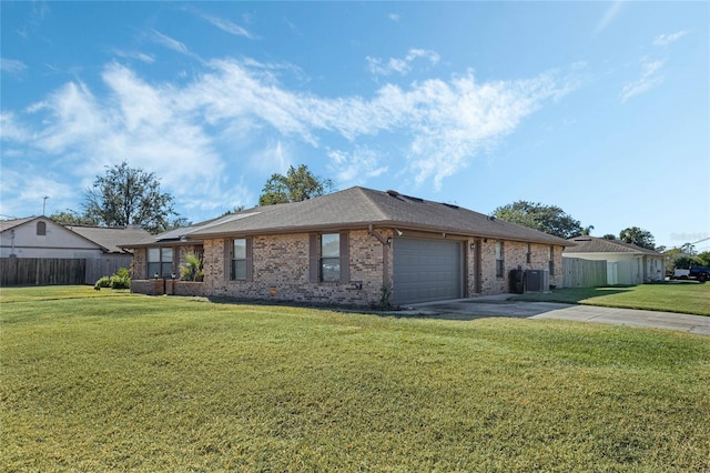 ranch-style house featuring cooling unit, a front yard, and a garage