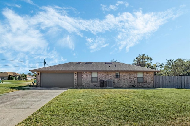 view of front facade with a front yard and a garage