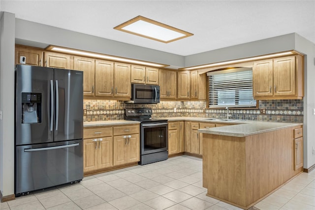 kitchen with light tile patterned floors, backsplash, stainless steel appliances, and sink