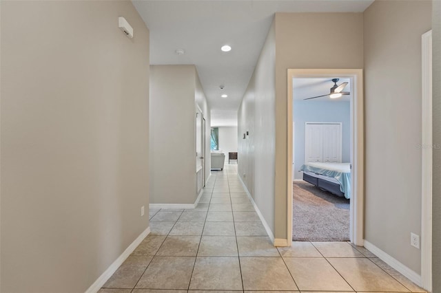 hallway featuring light tile patterned flooring