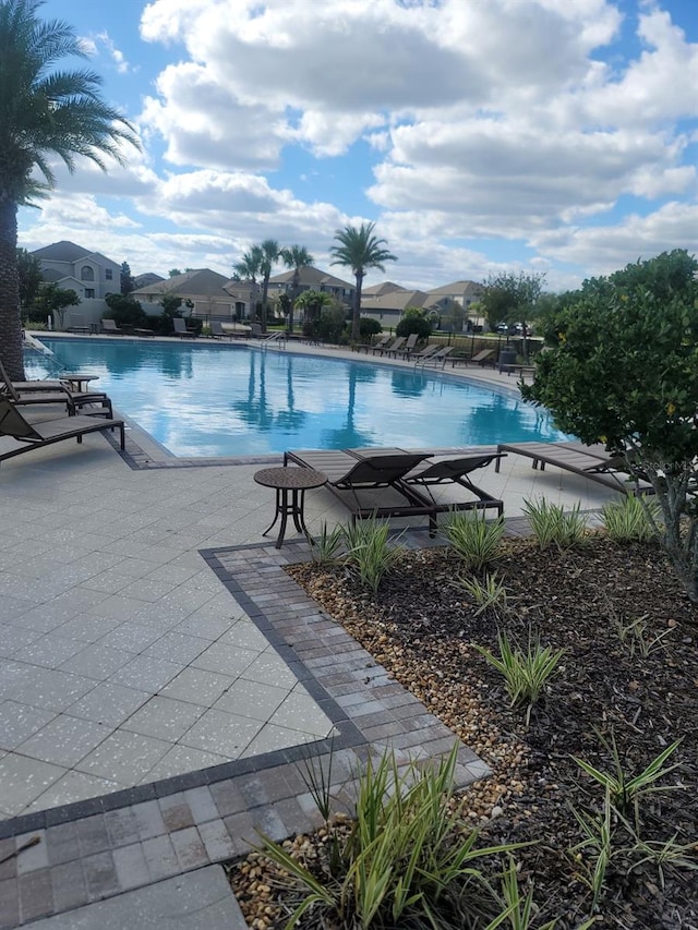 pool with a patio area