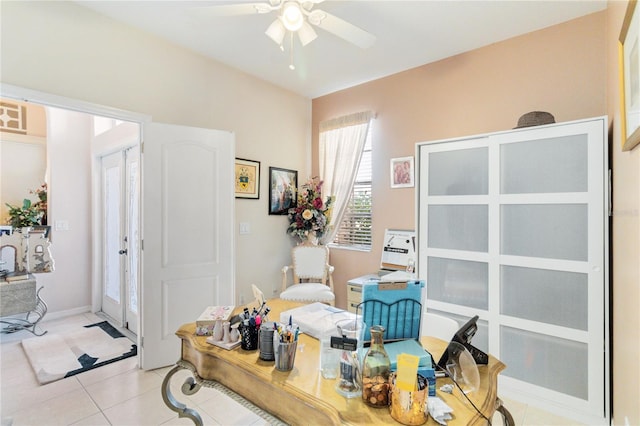 home office featuring light tile patterned flooring and ceiling fan