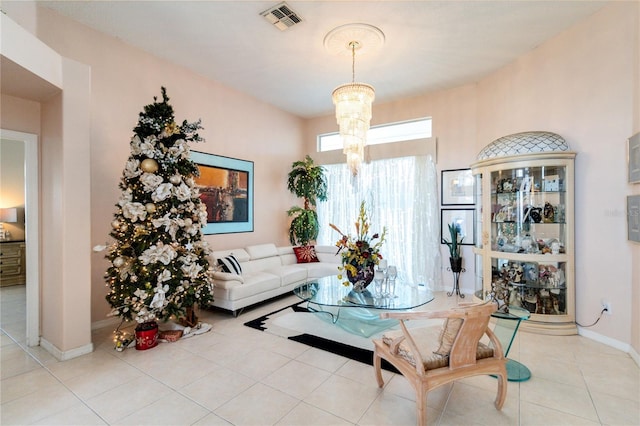 tiled living room featuring a notable chandelier