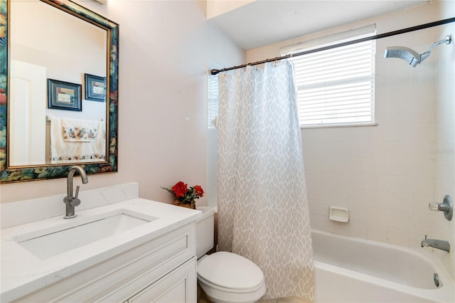 full bathroom with vanity, shower / tub combo with curtain, and toilet