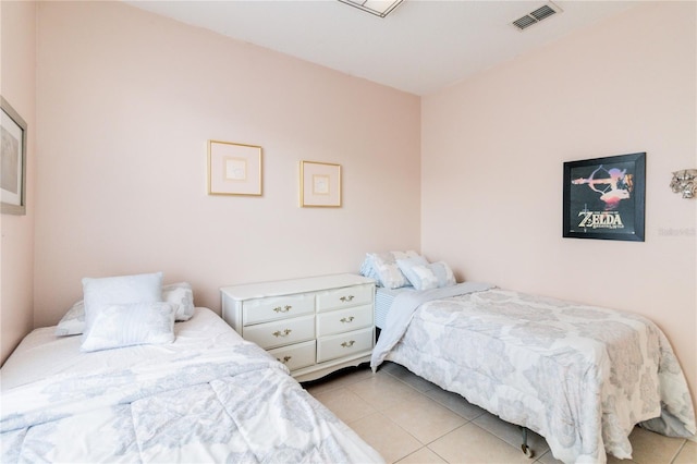 bedroom with light tile patterned floors