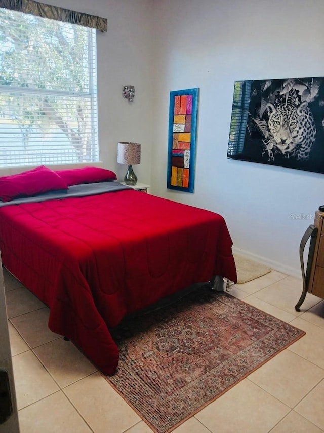 bedroom featuring light tile patterned floors