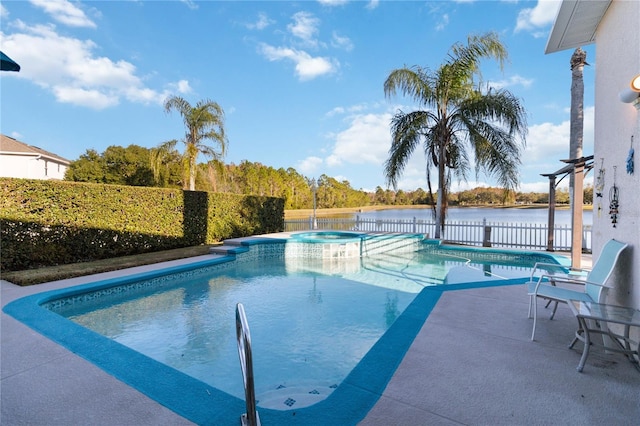 view of swimming pool featuring an in ground hot tub, a patio, and a water view