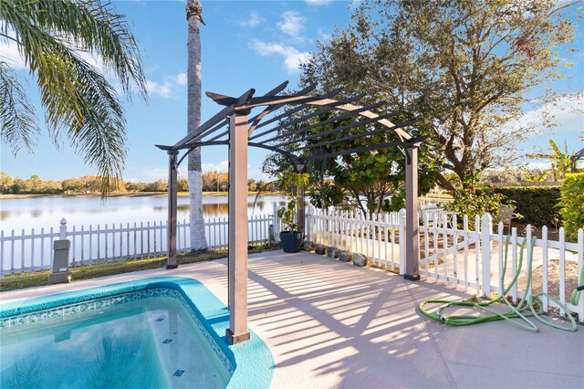 view of swimming pool featuring a water view and a pergola