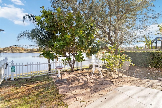 view of patio with a water view