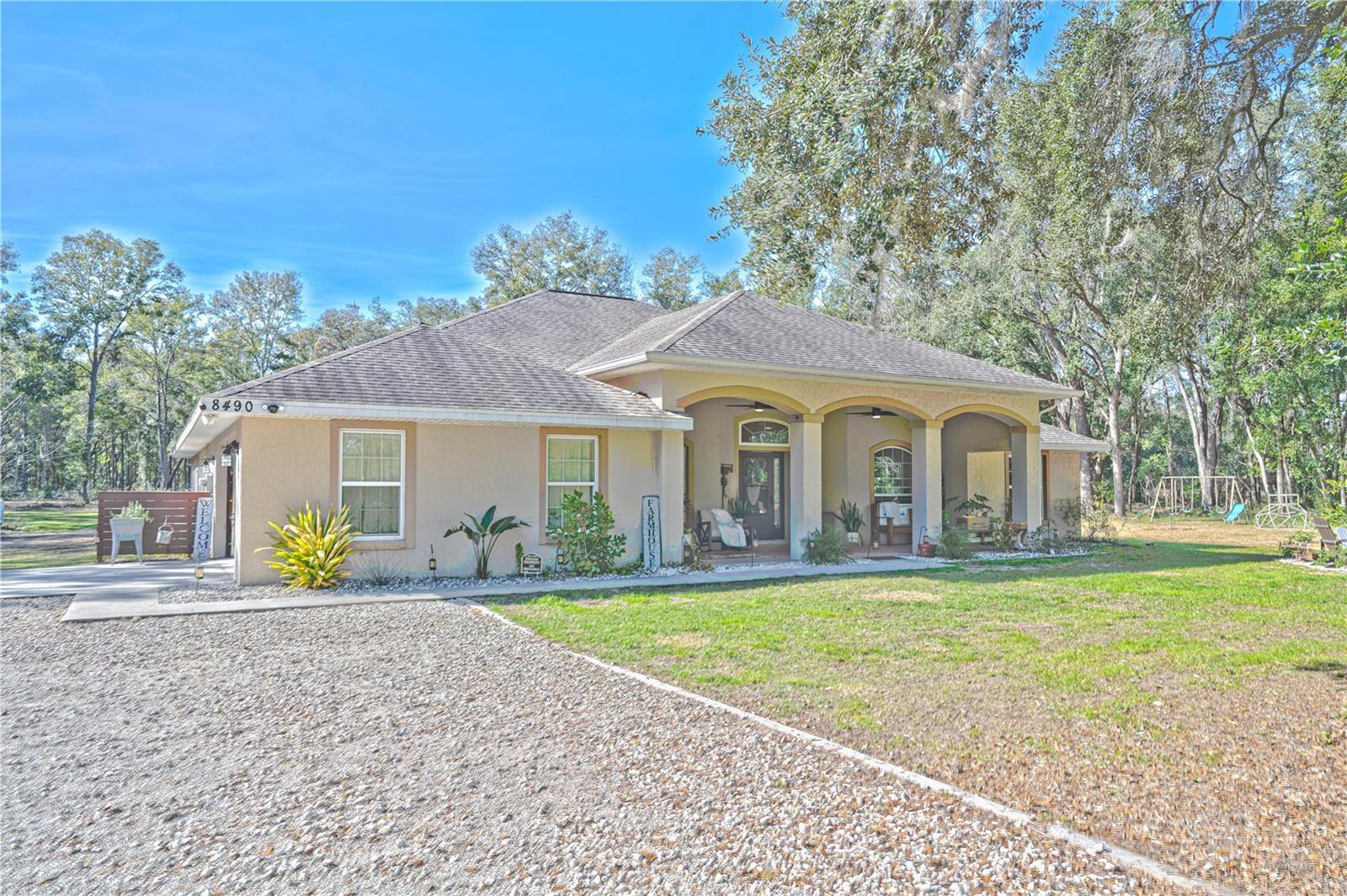 view of front of home with a garage and a front lawn