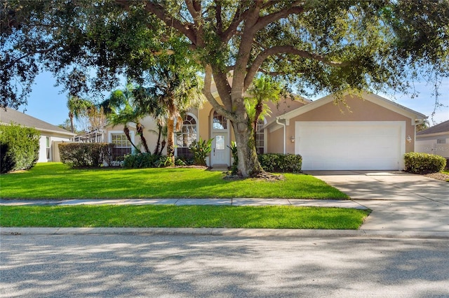 view of front facade with a garage and a front lawn