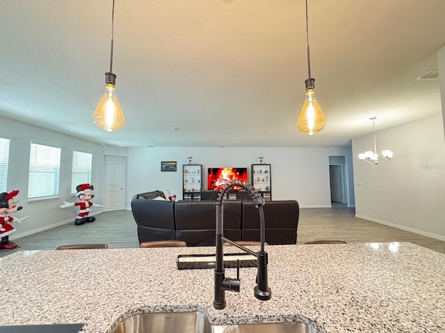 living room featuring hardwood / wood-style flooring and a chandelier