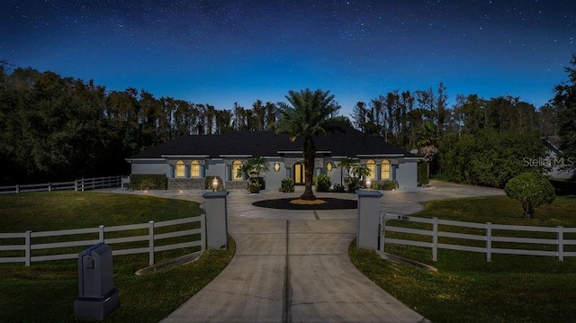 ranch-style home with a front yard