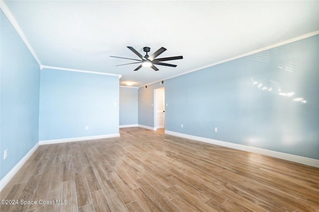 empty room with ceiling fan, crown molding, and light hardwood / wood-style flooring