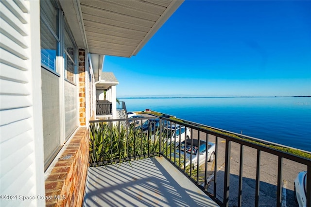 balcony featuring a water view