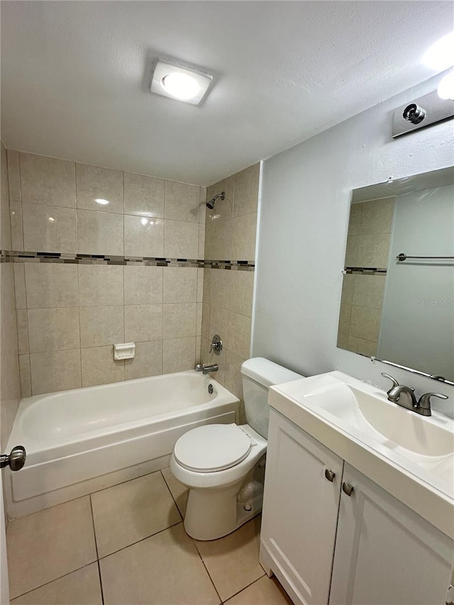 full bathroom featuring vanity, tile patterned floors, and tiled shower / bath