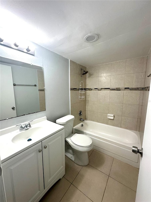 full bath featuring toilet, shower / bathing tub combination, vanity, and tile patterned floors