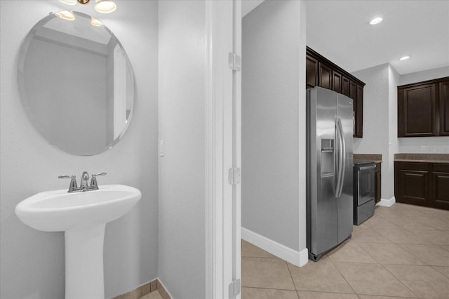 bathroom featuring tile patterned floors and sink