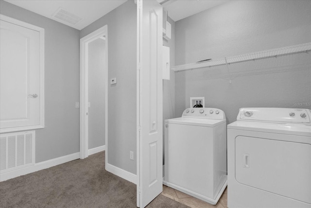 washroom with light colored carpet and independent washer and dryer