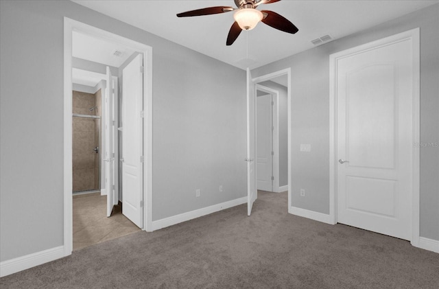 unfurnished bedroom featuring ceiling fan and light carpet