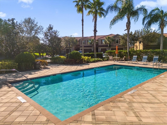 view of swimming pool with a patio area