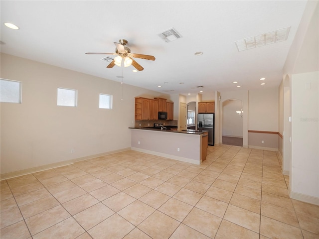 kitchen featuring kitchen peninsula, ceiling fan, light tile patterned flooring, and stainless steel refrigerator with ice dispenser