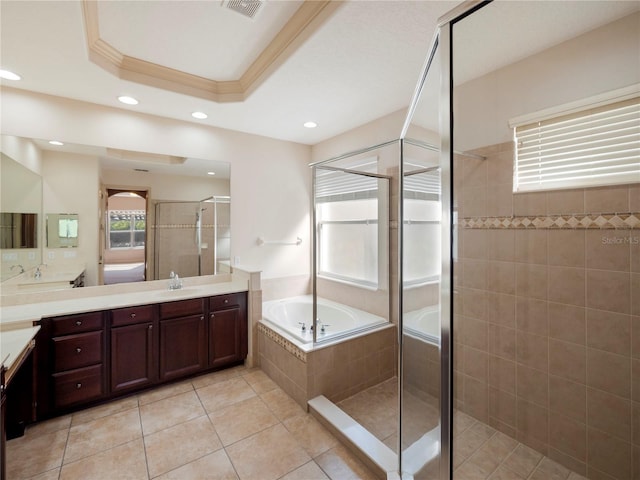 bathroom featuring tile patterned floors, crown molding, vanity, and plus walk in shower