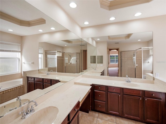 bathroom featuring a raised ceiling, tile patterned flooring, vanity, and independent shower and bath