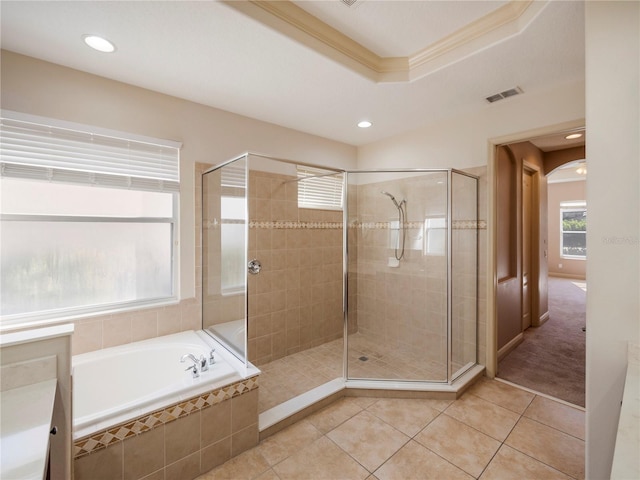 bathroom with tile patterned floors, vanity, shower with separate bathtub, and ornamental molding