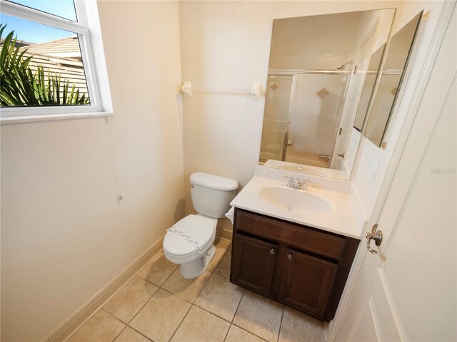 8320 Via Bella Notte, Orlando, FL 32836 - bathroom with tile patterned floors, a shower with door, and vanity
