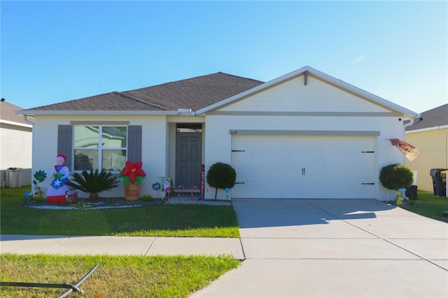 ranch-style home with a front yard and a garage