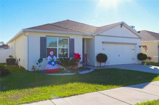 ranch-style house with a garage and a front lawn