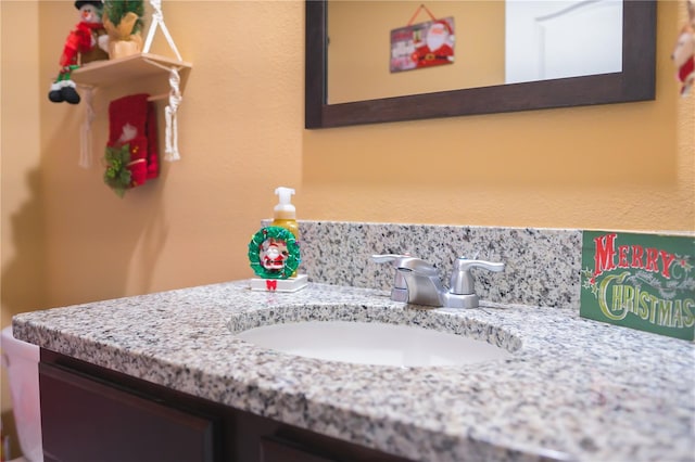 bathroom with vanity and backsplash