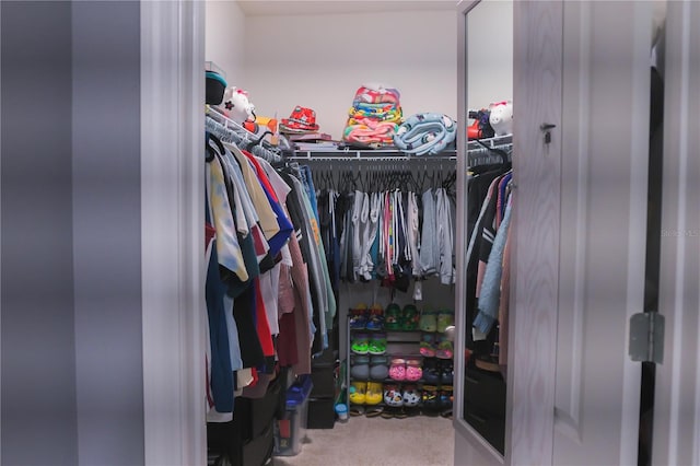 walk in closet featuring carpet