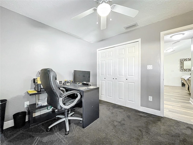 office area with dark colored carpet, a textured ceiling, ceiling fan, and lofted ceiling