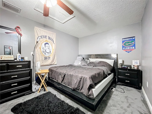 bedroom with light carpet, a textured ceiling, and ceiling fan