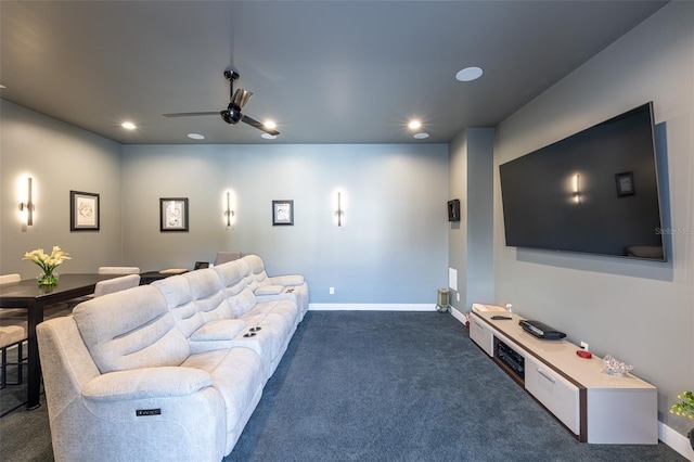 carpeted home theater featuring ceiling fan