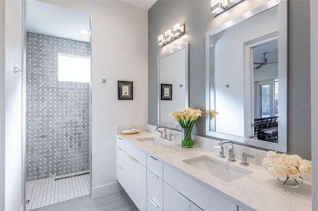 bathroom featuring wood-type flooring, vanity, and walk in shower