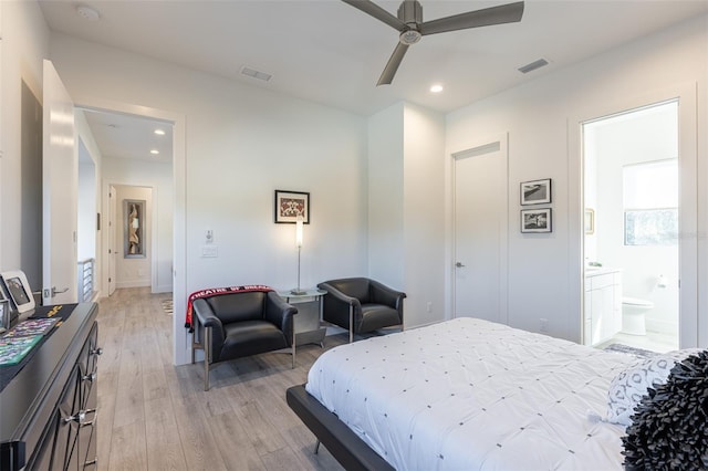 bedroom with connected bathroom, ceiling fan, and light wood-type flooring