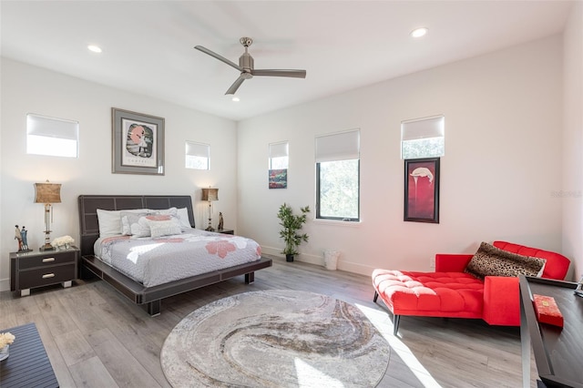 bedroom featuring light hardwood / wood-style floors and ceiling fan