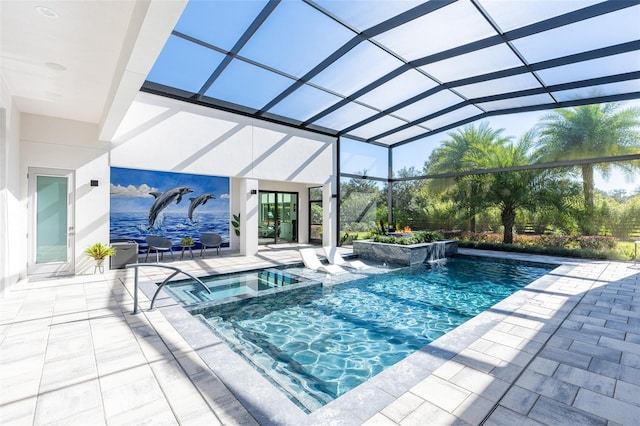 view of swimming pool featuring an in ground hot tub, a patio, pool water feature, and a lanai