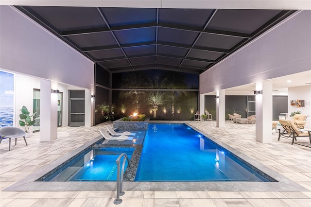 view of swimming pool with a patio area and a hot tub