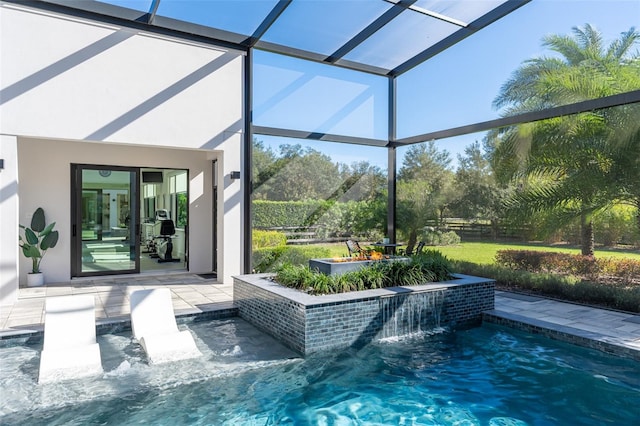 view of pool with pool water feature, a patio area, a lanai, and french doors