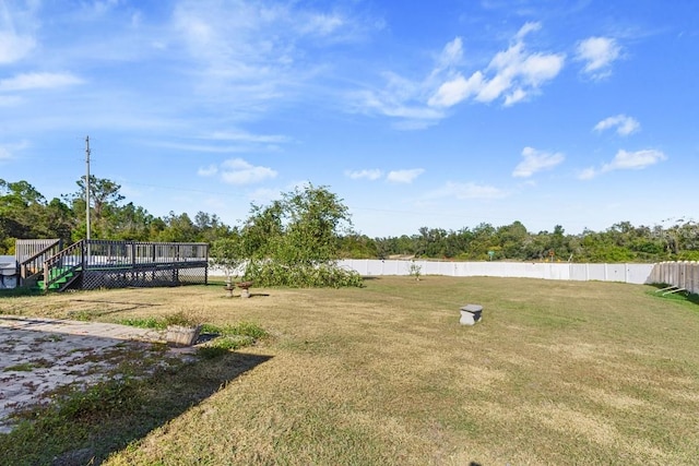 view of yard with a wooden deck